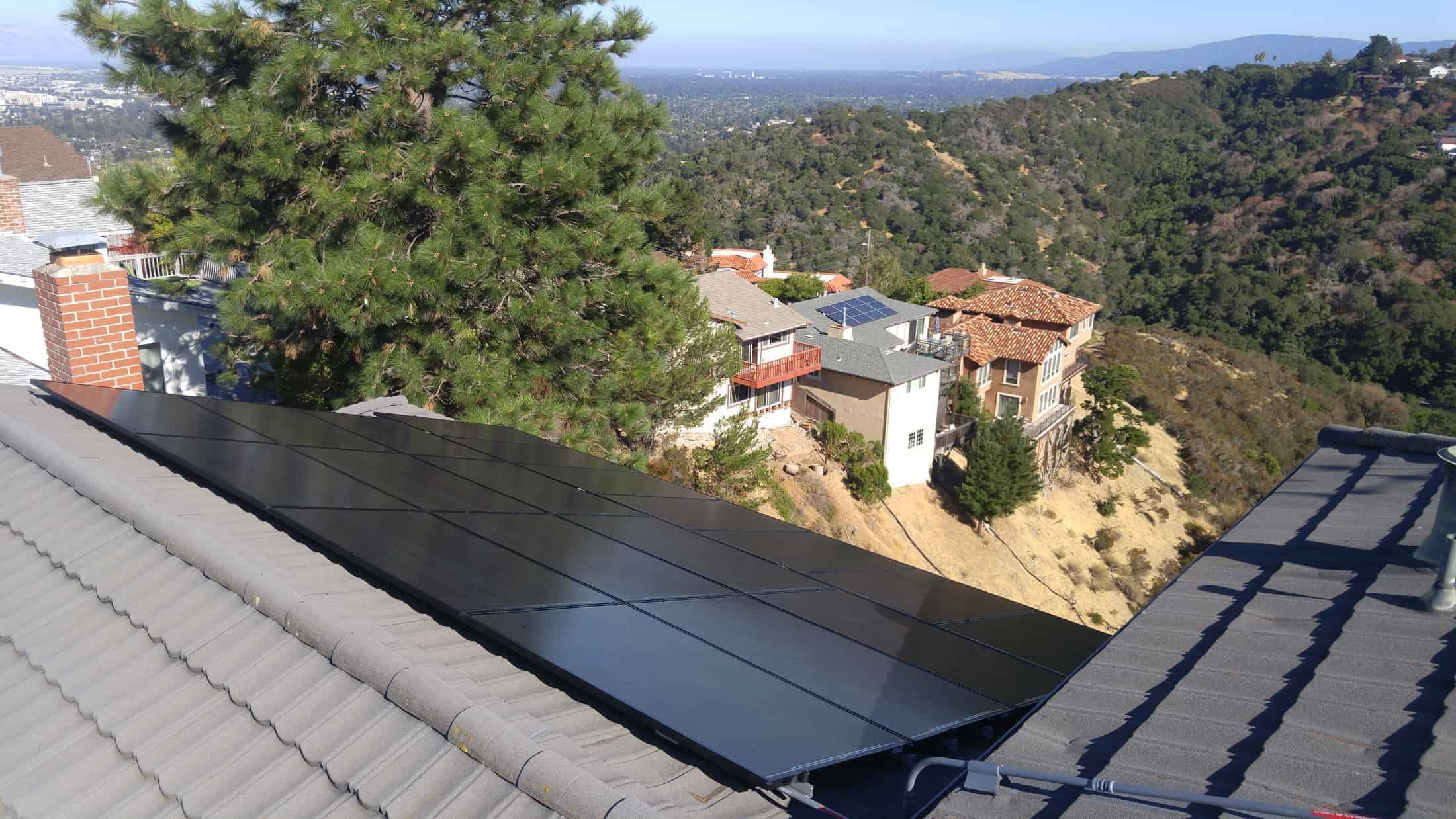 A solar installation by Michael & Sun Solar on a roof consisting of concrete tiles.